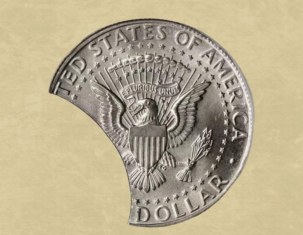 2009 Kennedy half dollar clipped planchet error showing distinctive curved missing section at the coin edge